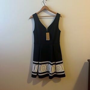 NWT- size medium- Francesca’s black & lace dress